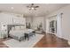 Bright main bedroom with hardwood floors, king bed, decor, and private access to the outdoor area at 10205 E Corrine Dr, Scottsdale, AZ 85260