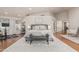 Spacious main bedroom featuring a patterned rug, bench, and a large, comfortable king-size bed at 10205 E Corrine Dr, Scottsdale, AZ 85260