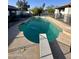 Backyard showcasing a large swimming pool with diving board at 10205 E Corrine Dr, Scottsdale, AZ 85260