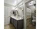 Bathroom with a double sink vanity, neutral walls and access to the shower and toilet at 112 E Joseph Way, Gilbert, AZ 85295