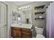 Cozy bathroom featuring a classic vanity and shelves for storage at 112 E Joseph Way, Gilbert, AZ 85295