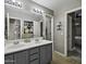 Bathroom featuring a dual sink vanity, neutral walls and great lighting at 112 E Joseph Way, Gilbert, AZ 85295