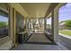 Relaxing covered patio with a seating area, privacy curtains, and a decorative design at 112 E Joseph Way, Gilbert, AZ 85295
