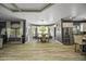 Bright, open dining area boasts wood floors, a stylish chandelier, and ample natural light for delightful meals at 112 E Joseph Way, Gilbert, AZ 85295