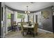Elegant dining room features a round table, comfortable seating, and large windows for natural light and scenic views at 112 E Joseph Way, Gilbert, AZ 85295