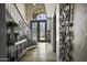 Grand entryway featuring a curved staircase, decorative lighting, and a stunning double door with glass accents at 112 E Joseph Way, Gilbert, AZ 85295