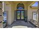 Inviting front entrance with double doors, sidelights, and a charming arched window above the doorway at 112 E Joseph Way, Gilbert, AZ 85295
