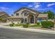 Charming two-story home with landscaped front yard and a three car garage, perfect for suburban living at 112 E Joseph Way, Gilbert, AZ 85295