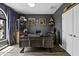 Elegant home office with custom built-ins, sophisticated decor, and a large desk for productivity at 112 E Joseph Way, Gilbert, AZ 85295