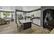 Modern kitchen with white cabinets, granite countertops, stainless steel appliances, and a large center island at 112 E Joseph Way, Gilbert, AZ 85295