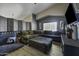 Comfortable living room with a stylish sectional sofa, ottoman and elegant decor at 112 E Joseph Way, Gilbert, AZ 85295