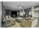 Comfortable living room featuring modern decor, ample seating, and a large television for ultimate relaxation and entertainment at 112 E Joseph Way, Gilbert, AZ 85295
