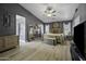Spacious main bedroom with dark gray accent walls, modern lighting, and light wood flooring, creating a stylish retreat at 112 E Joseph Way, Gilbert, AZ 85295
