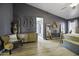 Stylish main bedroom featuring dark gray accent walls, neutral furnishings, and elegant decor, creating a cozy sanctuary at 112 E Joseph Way, Gilbert, AZ 85295