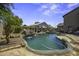 Backyard oasis featuring a lagoon-style pool, spa and rock waterfall at 112 E Joseph Way, Gilbert, AZ 85295