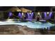 Inviting pool with rock features and custom lighting for evening ambiance at 112 E Joseph Way, Gilbert, AZ 85295
