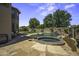 Backyard featuring a lagoon-style pool with a spa and rock waterfall at 112 E Joseph Way, Gilbert, AZ 85295