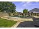 Backyard pool with a spa, waterfall feature, and stone surround perfect for relaxation at 112 E Joseph Way, Gilbert, AZ 85295