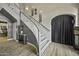 Elegant staircase with modern gray and white design, complemented by stylish wall decor and lighting at 112 E Joseph Way, Gilbert, AZ 85295