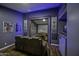 Cozy theater room with comfortable seating, a large screen, and custom bar area for ultimate entertainment at 112 E Joseph Way, Gilbert, AZ 85295