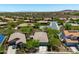 An aerial view of a community with houses, desert landscaping, and views of mountains in the distance at 12727 W Lowden Rd, Peoria, AZ 85383