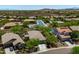 This aerial view highlights a charming home in a tranquil neighborhood with mountain views at 12727 W Lowden Rd, Peoria, AZ 85383