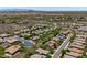 An aerial shot showing desert homes, landscaping, and winding roads, many with solar panels on the roofs at 12727 W Lowden Rd, Peoria, AZ 85383