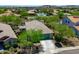 An aerial view shows a well-maintained single-Gathering home with a two-car garage, and a neatly landscaped yard at 12727 W Lowden Rd, Peoria, AZ 85383