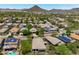 Overhead shot of houses with desert landscaping, some with solar panels, set against rolling mountains in the background at 12727 W Lowden Rd, Peoria, AZ 85383