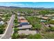 An aerial view of a beautiful community featuring lush landscaping, homes, and mountains in the background at 12727 W Lowden Rd, Peoria, AZ 85383