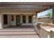 Covered backyard patio featuring a built-in BBQ grill, ceiling fan and comfortable outdoor living space at 12727 W Lowden Rd, Peoria, AZ 85383