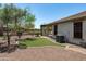 This home features a pristine backyard with artificial turf and desert landscaping at 12727 W Lowden Rd, Peoria, AZ 85383