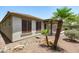 An inviting backyard features desert landscaping and a covered patio with an outdoor kitchen at 12727 W Lowden Rd, Peoria, AZ 85383