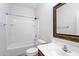Bathroom featuring a shower-tub combo, toilet and sink with medicine cabinet at 12727 W Lowden Rd, Peoria, AZ 85383