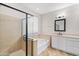 Bathroom featuring a glass-enclosed shower, soaking tub, and vanity with stylish countertops at 12727 W Lowden Rd, Peoria, AZ 85383