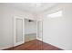 Bedroom with light and bright ambiance features hardwood floors and open doorway at 12727 W Lowden Rd, Peoria, AZ 85383