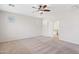 Spacious primary bedroom with plush carpeting, neutral paint, and a sliding door into the primary bath at 12727 W Lowden Rd, Peoria, AZ 85383