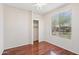 Bright bedroom with hardwood floors, closet, ceiling fan and view of backyard at 12727 W Lowden Rd, Peoria, AZ 85383