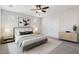 Staged bedroom with neutral paint, carpet, a queen bed, two nightstands, and dresser at 12727 W Lowden Rd, Peoria, AZ 85383