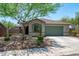 Attractive single-story home boasting mature landscaping, well-kept flower beds, and a two-car garage at 12727 W Lowden Rd, Peoria, AZ 85383