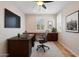 Virtually staged home office with a modern desk, comfortable chair, and stylish decor at 12727 W Lowden Rd, Peoria, AZ 85383