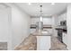Kitchen with island, stainless appliances, neutral paint, and granite countertops at 12727 W Lowden Rd, Peoria, AZ 85383
