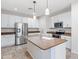Kitchen with island, stainless appliances, white cabinets and granite countertops at 12727 W Lowden Rd, Peoria, AZ 85383