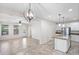 Open-concept kitchen and living room with tile flooring, neutral paint, ceiling fan, and recessed lighting at 12727 W Lowden Rd, Peoria, AZ 85383