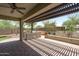 Charming outdoor kitchen boasts a built-in grill, perfect for entertaining guests in the backyard at 12727 W Lowden Rd, Peoria, AZ 85383