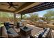 Inviting outdoor space showcases an outdoor kitchen and comfortable seating under a pergola at 12727 W Lowden Rd, Peoria, AZ 85383