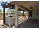 Covered patio with a built-in BBQ area, ideal for outdoor dining and relaxation at 12727 W Lowden Rd, Peoria, AZ 85383