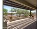 Relaxing covered patio features a built-in barbecue and brick pavers at 12727 W Lowden Rd, Peoria, AZ 85383