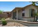 Exterior showcases a private side yard with tasteful landscaping, a covered porch, and stucco walls at 12727 W Lowden Rd, Peoria, AZ 85383