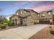 Charming two-story home featuring a tile roof, neutral paint, and an attached two car garage at 13088 N 91St Dr, Peoria, AZ 85381